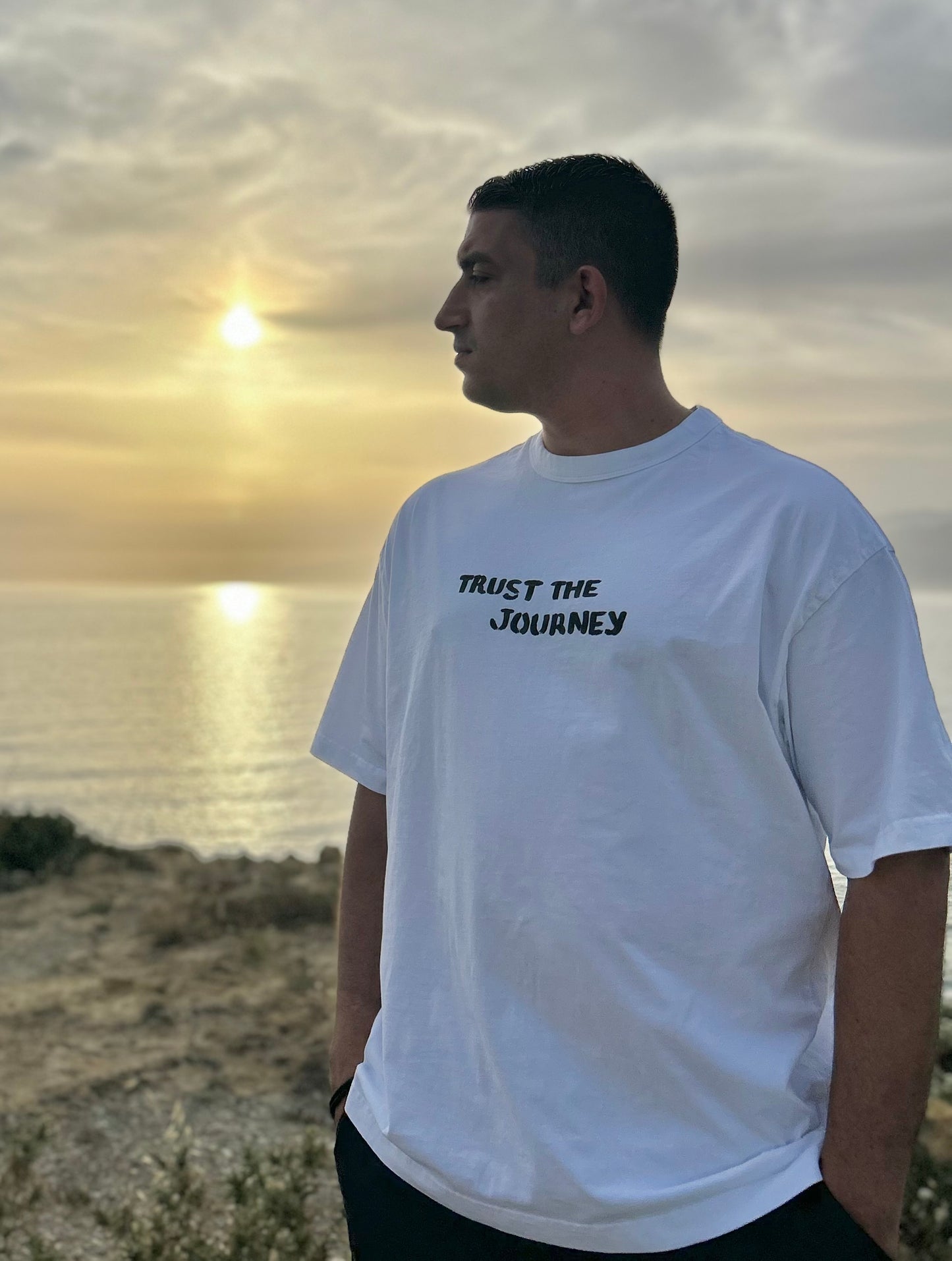 White oversized unisex handpainted T-shirt - “Trust the journey”