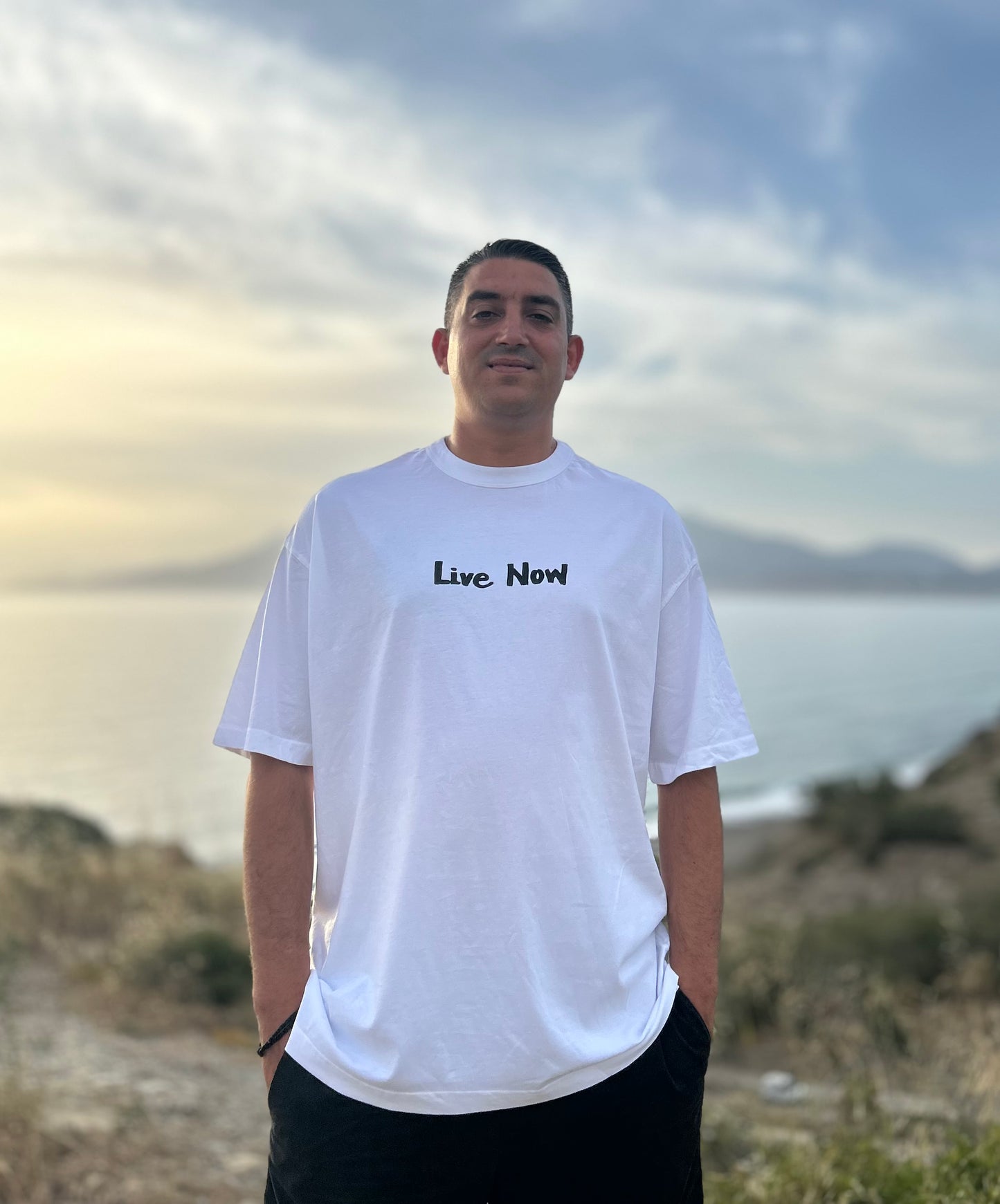 White oversized unisex handpainted T-shirt - “Live now”