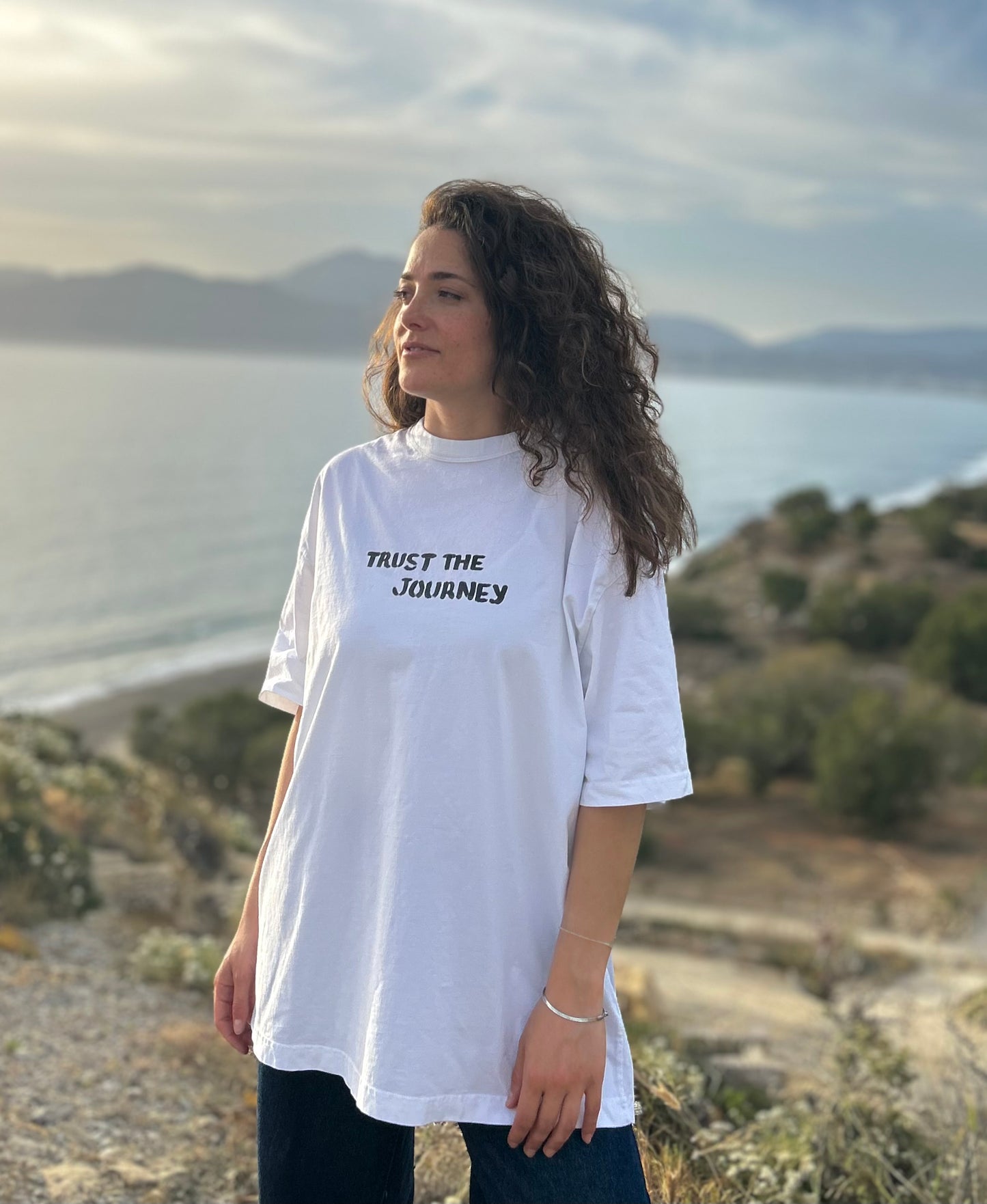White oversized unisex handpainted T-shirt - “Trust the journey”