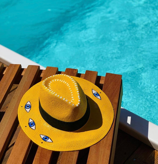 Yellow handpainted panama hat - “evil eyes”